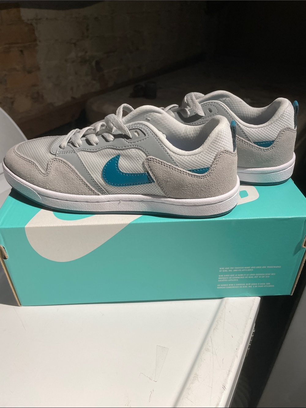 Nike Kids Light Gray Sneakers with Teal Swoosh